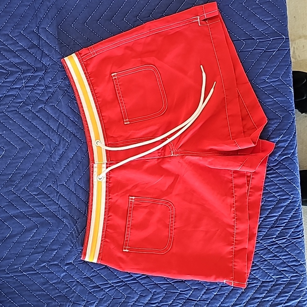 Junior cargo shorts red and neon orange size 9/11 medium.